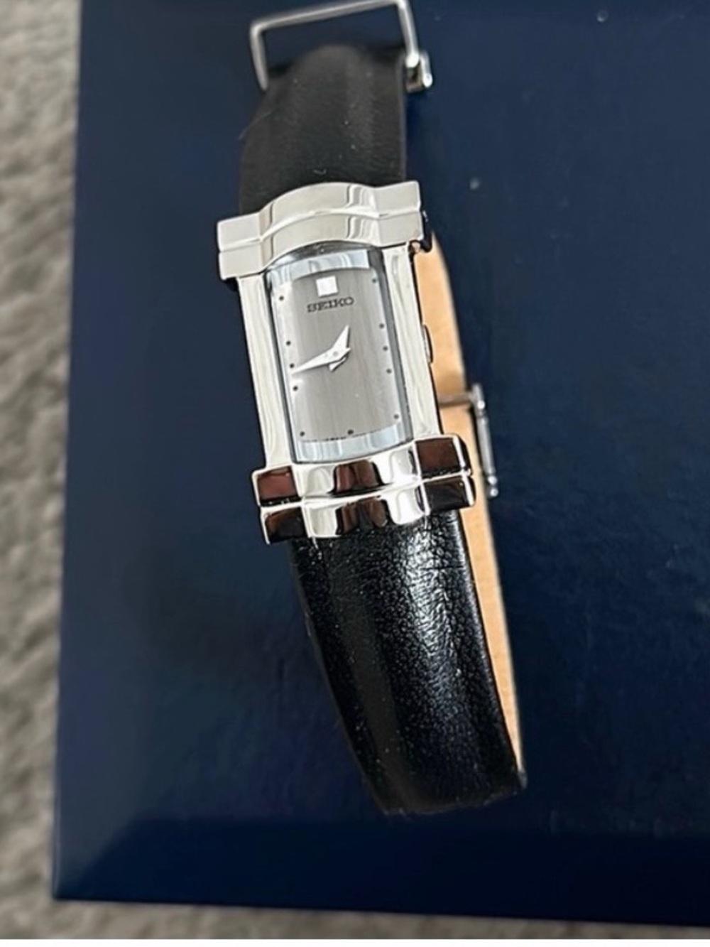 Seiko Black leather band , silver rectangular face , new batteries replaced